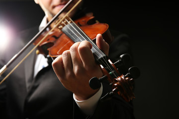 Musician play violin on black background, close up © Africa Studio