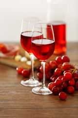 Two wineglasses with grape on the table, close-up