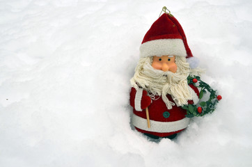 Christmas decoration Santa Claus in snow.
