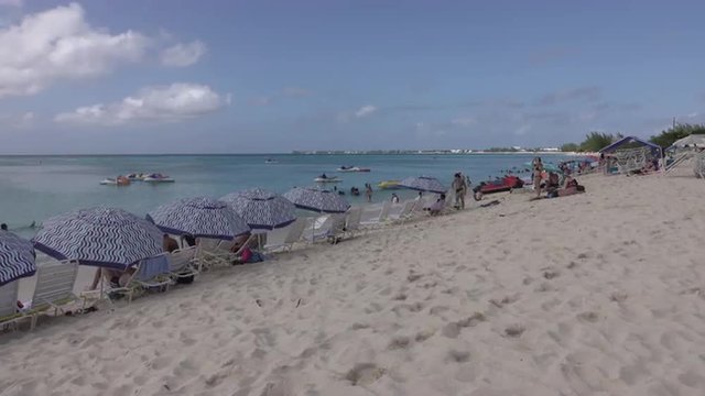 Grand Cayman Island Caribbean Ocean sandy beach paradise 4K. Cruise ship and vacation. Banking investment center. Beach, scuba diving and resorts cater to tourists. Don Despain of Rekindle Photo.