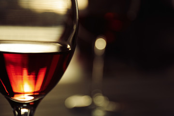 Glass of red wine on blurred background