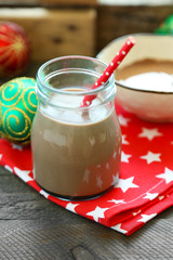 Chocolate dessert and chocolate milk cocktail on wooden background