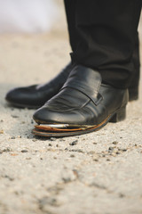 Cigarette in Man's Shoe