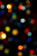 Fototapeta premium Color blurred bokeh lights. Useful for Christmas background or greeting cards.