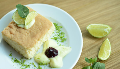 Traditional cake with lime on table