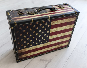 Old style voyage suitcase with travel stickers