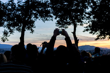 Crowd people together outdoor waiting for sunset