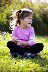 Fototapeta premium portrait of a little girl in the park