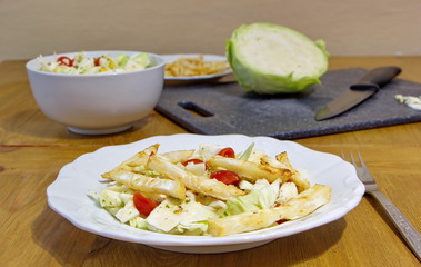 healthy lunch consists of celery chips, cabbage, corns and tomatoes
