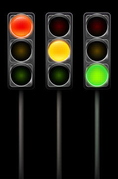 Traffic Light In Three Positions On Black Background