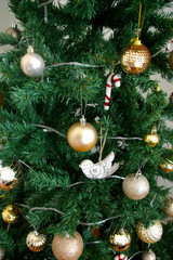 Artificial Christmas tree decorated with presents underneath
