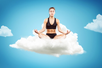 Woman meditating on a cloud
