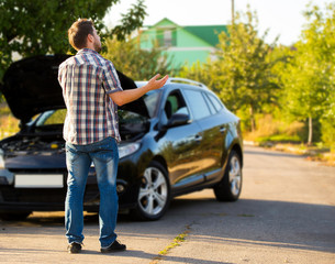 Desperate man calling for assistance after breaking down in a car