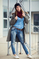 young woman in urban wear style with different emotions on parki