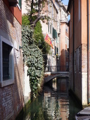 narrow canal in Venezia with houses