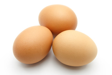 Three eggs on white background