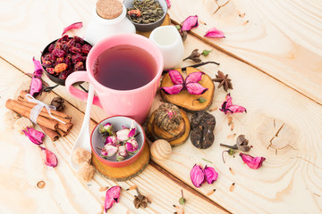 Tea cups with teapot on old wooden table