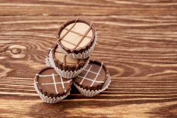 Dark chocolate on wooden background
