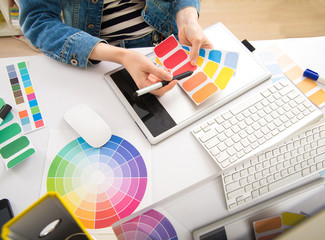Young Handsome Graphic designer using graphics tablet to do his