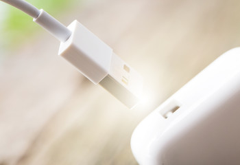 Charger with device on wooden desk