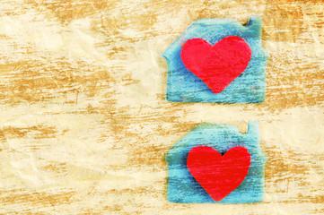 Two red hearts in a lodge on crumpled yellow paper. A card with scenery from plasticine by St. Valentine's Day. Romantic festive card. Valentine's Day card.