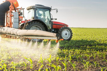 Tractor spraying pesticides