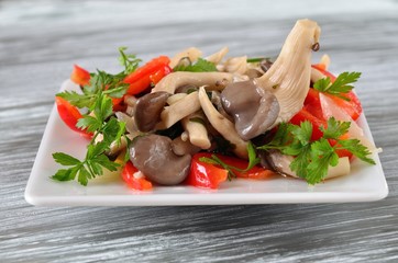 Appetizer of pickled oyster mushrooms, bell pepper,onion, parsley