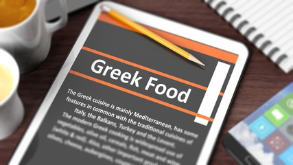 Tabletop with various objects focused on tablet with "Greek Food" content on screen