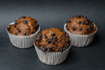 chocolate muffins on a dark background