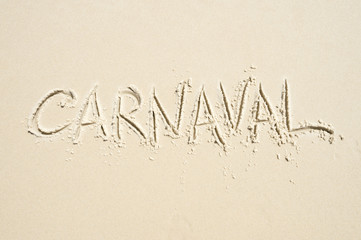 Carnival message handwritten in smooth sand on Ipanema Beach in Rio de Janeiro, Brazil 