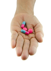 pills capsule on hand outstretched