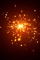 Obraz premium Christmas sparkler in haze with red light