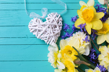 Colorful yellow and blue  flowers and decorative heart