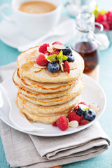 Fluffy oatmeal pancakes stack with fresh berries