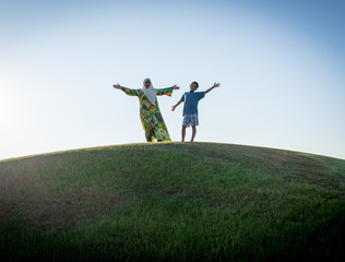 Muslim woman and son silhouette