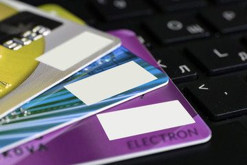 Color credit card on laptop keyboard .