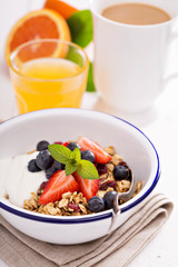Granola with fresh berries in a bowl