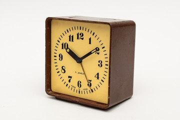 Brown square alarm clock on a white background