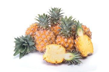 tropical pineapples on wooden background