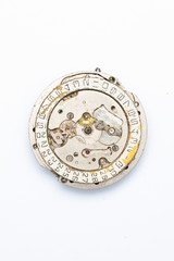 The clock mechanism on a white background