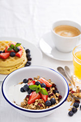 Granola with fresh berries in a bowl