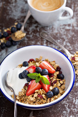 Granola with fresh berries in a bowl