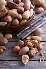 Variety of nuts with shells in a bowl