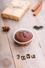 Chocolate muffin, gift box and word love