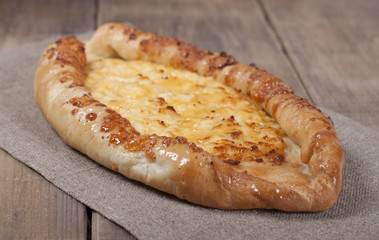 Khachapuri with cheese and egg.