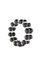 Black bracelet with beads on a white background