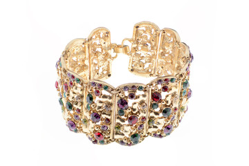 gold bracelet with colored gems on a white background