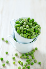 frozem peas on wooden surface