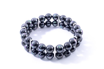 Bracelet with black pearls isolated on white