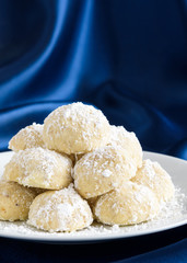 Holiday Russian Tea Cake cookies ready to eat on a white serving plate
